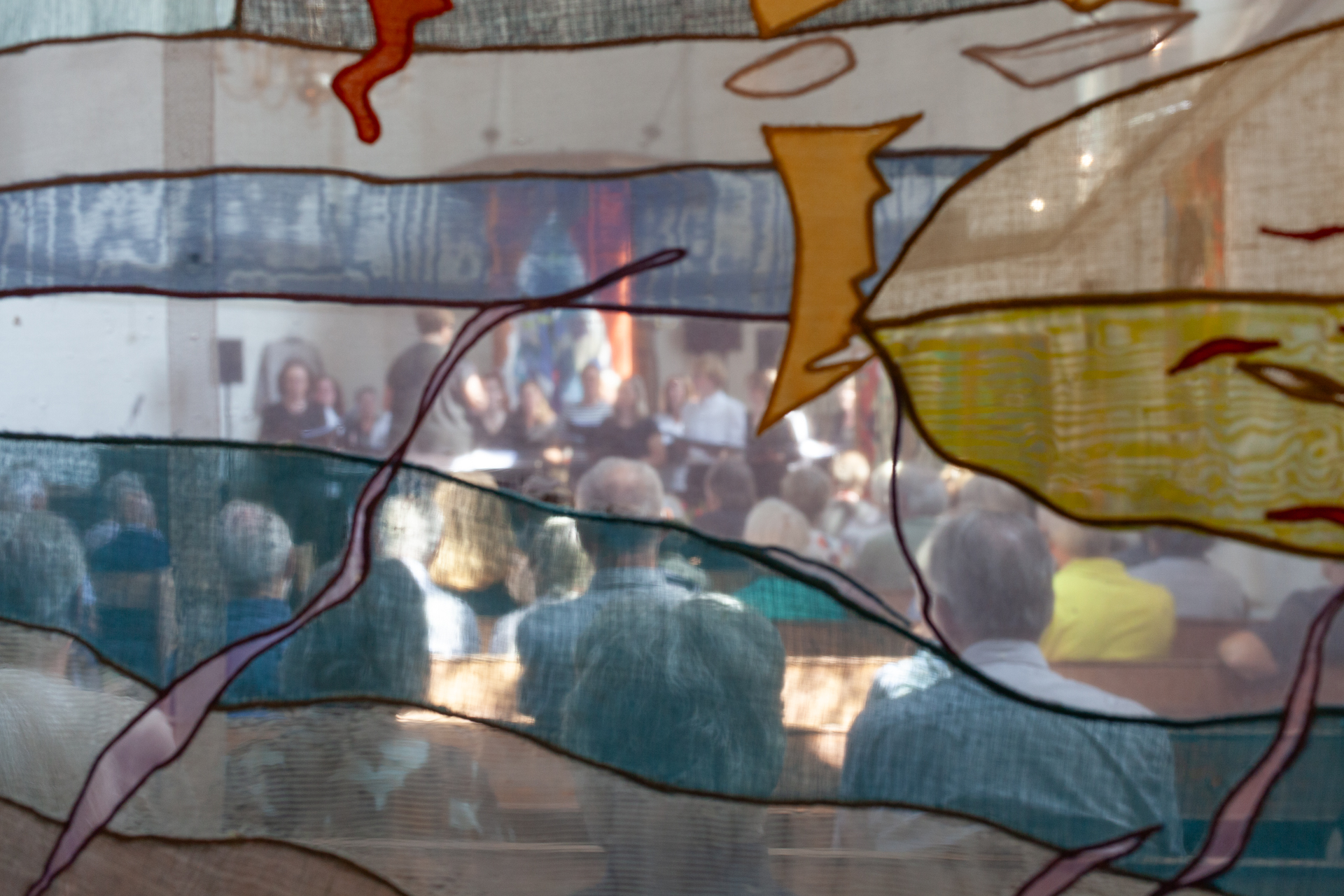 Expo beeld door textielwerk heen